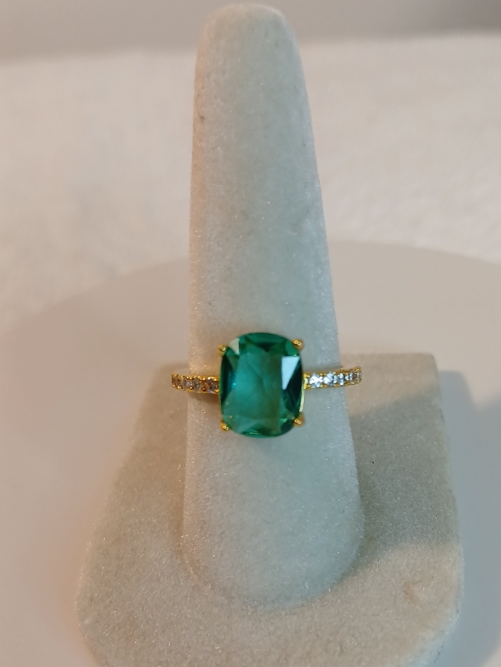 Gold Ring with Emerald Green Cushion Stone and Pavé Band